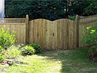 <b>Board on Board closed top spindle wood privacy fence with double arched gate</b>
